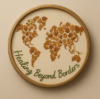 A graphic showing a world map inside of a circle, underneath the text reads healing beyond borders